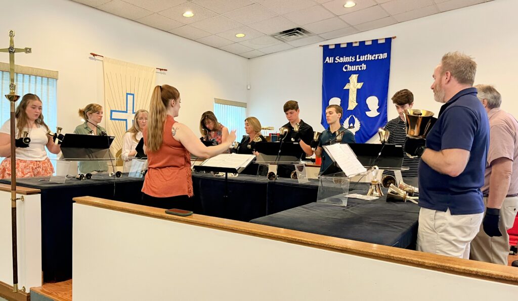 A photo of the handbell choir performing